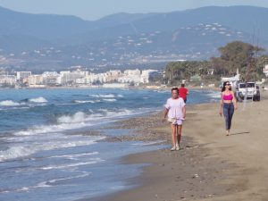 Walking down the Costa del Sol beach